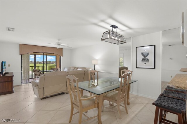 12170 Kelly Sands Way Unit 721, Fort Myers, FL 33908 - dining area featuring light tile patterned flooring and a ceiling fan