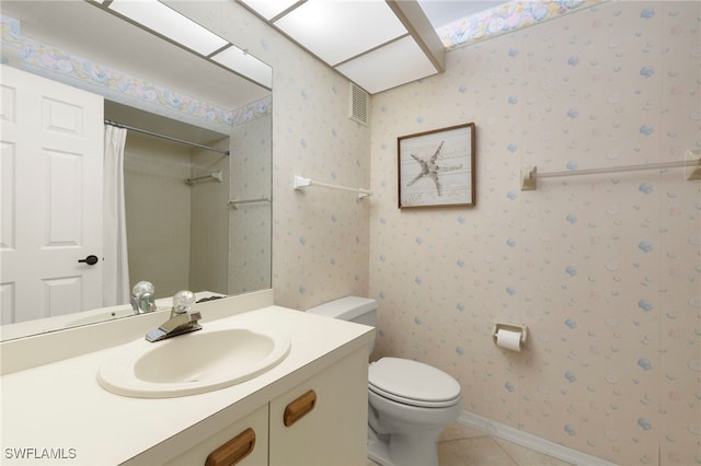 12170 Kelly Sands Way Unit 721, Fort Myers, FL 33908 - bathroom with tile patterned flooring, toilet, vanity, and a shower with shower curtain