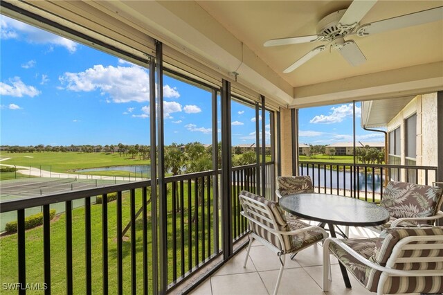 12170 Kelly Sands Way Unit 721, Fort Myers, FL 33908 - sunroom featuring a water view, a ceiling fan, and view of golf course