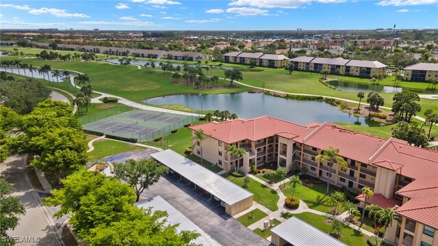 12170 Kelly Sands Way Unit 721, Fort Myers, FL 33908 - aerial perspective of suburban area featuring a nearby body of water and a golf course