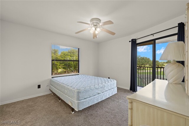 12170 Kelly Sands Way Unit 721, Fort Myers, FL 33908 - bedroom with access to outside, multiple windows, and carpet flooring