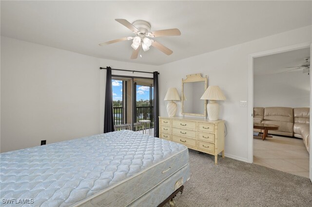 12170 Kelly Sands Way Unit 721, Fort Myers, FL 33908 - bedroom with access to outside, light carpet, a ceiling fan, baseboards, and light tile patterned floors