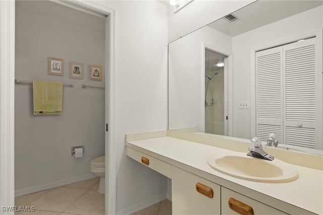 12170 Kelly Sands Way Unit 721, Fort Myers, FL 33908 - bathroom with toilet, vanity, tile patterned flooring, a shower, and baseboards