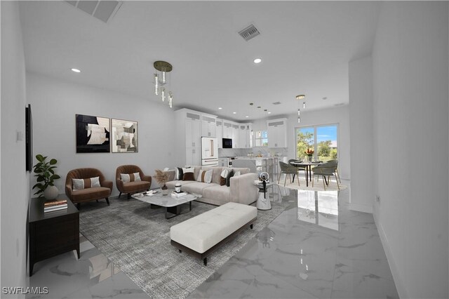 420-422 Grant Blvd, Lehigh Acres, FL 33974 - living room with light marble finish flooring and recessed lighting
