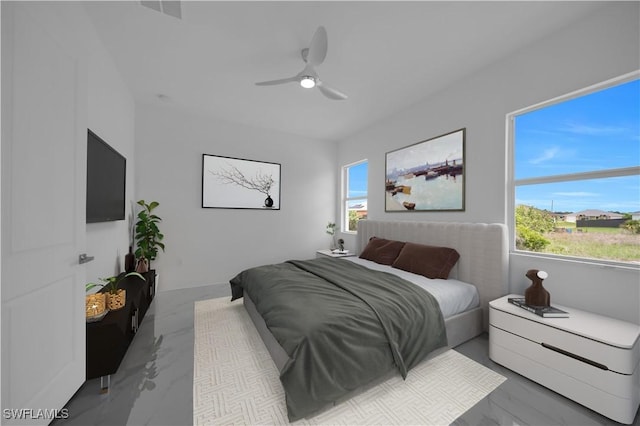 420-422 Grant Blvd, Lehigh Acres, FL 33974 - bedroom with marble finish flooring, multiple windows, and a ceiling fan