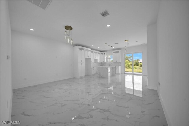 420-422 Grant Blvd, Lehigh Acres, FL 33974 - unfurnished living room featuring recessed lighting and light marble finish flooring