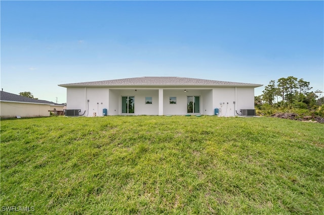420-422 Grant Blvd, Lehigh Acres, FL 33974 - rear view of property with a yard and stucco siding