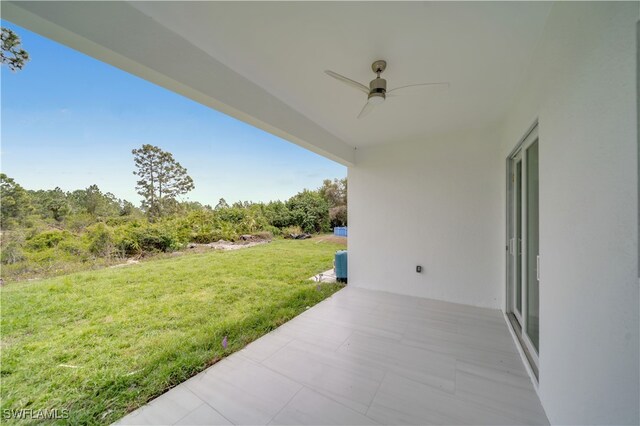 420-422 Grant Blvd, Lehigh Acres, FL 33974 - view of green lawn with ceiling fan and a patio area