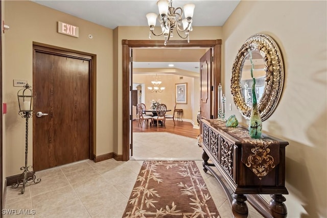 6021 Silver King Blvd Unit 302, Cape Coral, FL 33914 - entrance foyer with a chandelier and light tile patterned flooring