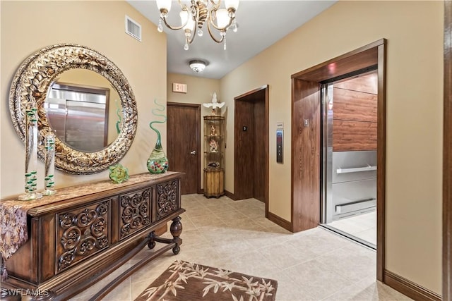 6021 Silver King Blvd Unit 302, Cape Coral, FL 33914 - corridor with a chandelier, light tile patterned flooring, and elevator