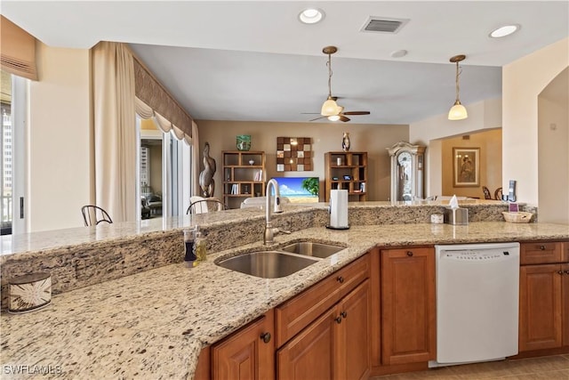 6021 Silver King Blvd Unit 302, Cape Coral, FL 33914 - kitchen featuring white dishwasher, ceiling fan, healthy amount of natural light, light stone countertops, and recessed lighting
