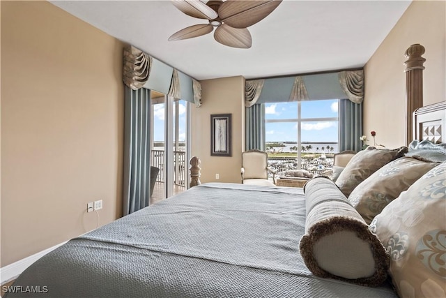 6021 Silver King Blvd Unit 302, Cape Coral, FL 33914 - bedroom with access to exterior, multiple windows, and a ceiling fan