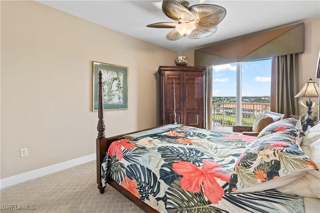 6021 Silver King Blvd Unit 302, Cape Coral, FL 33914 - carpeted bedroom with baseboards and a ceiling fan