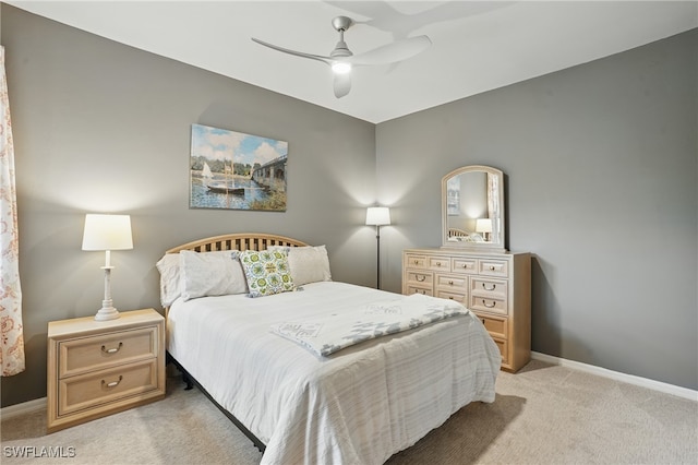 2232 Carnaby Ct, Lehigh Acres, FL 33973 - bedroom with light carpet and a ceiling fan