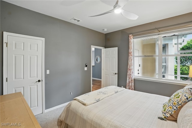 2232 Carnaby Ct, Lehigh Acres, FL 33973 - carpeted bedroom featuring baseboards and a ceiling fan