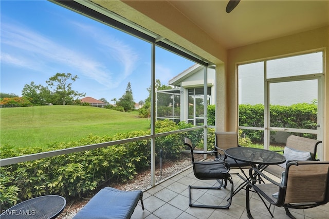 2232 Carnaby Ct, Lehigh Acres, FL 33973 - sunroom / solarium with plenty of natural light, ceiling fan, and a water view
