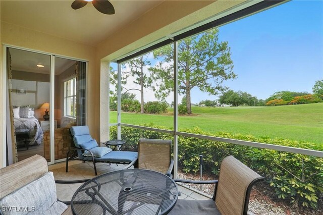 2232 Carnaby Ct, Lehigh Acres, FL 33973 - sunroom / solarium with a ceiling fan and outdoor dining area