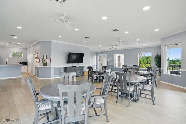2232 Carnaby Ct, Lehigh Acres, FL 33973 - dining space featuring ceiling fan, recessed lighting, crown molding, and light wood-style flooring