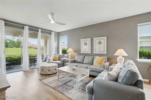 2232 Carnaby Ct, Lehigh Acres, FL 33973 - living room with wood finished floors and ceiling fan