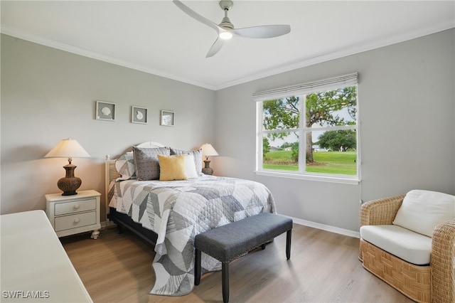 2232 Carnaby Ct, Lehigh Acres, FL 33973 - bedroom featuring wood finished floors, crown molding, and a ceiling fan