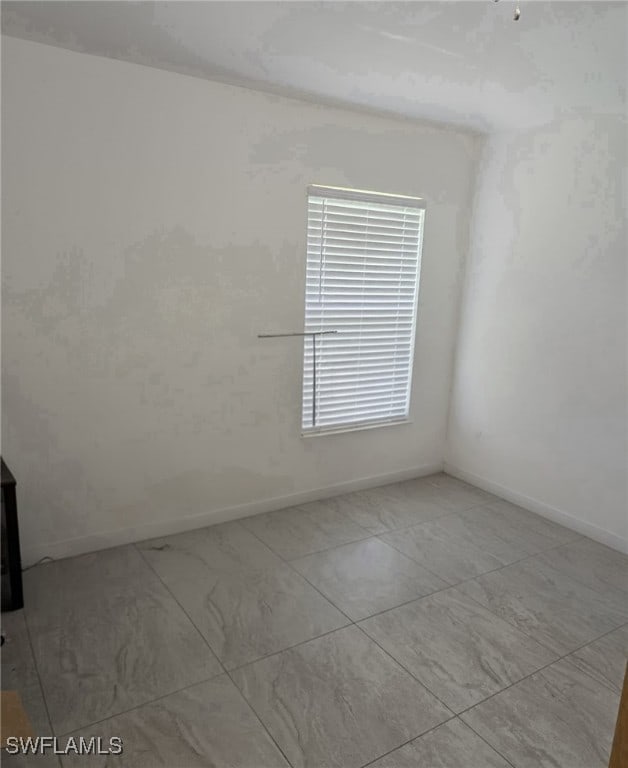 8340 Gassner Way, Lehigh Acres, FL 33972 - unfurnished room featuring baseboards