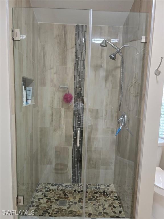 8340 Gassner Way, Lehigh Acres, FL 33972 - bathroom with a shower stall