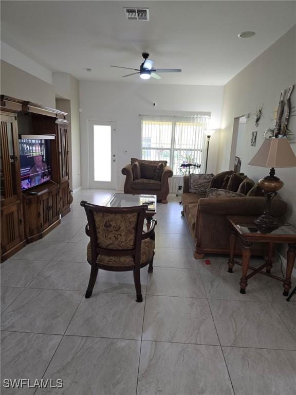 8340 Gassner Way, Lehigh Acres, FL 33972 - living room featuring a ceiling fan