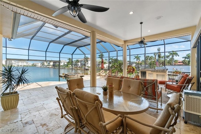 431 Palm Ct, Naples, FL 34108 - view of patio / terrace with ceiling fan, glass enclosure, and outdoor dining area
