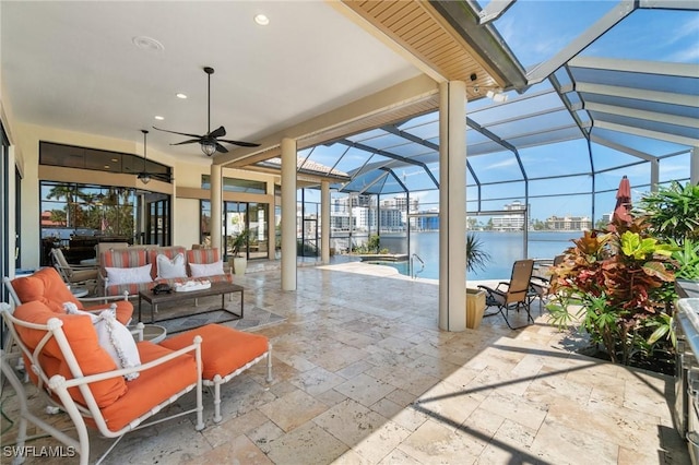 431 Palm Ct, Naples, FL 34108 - view of patio featuring an outdoor hangout area, ceiling fan, a lanai, an outdoor pool, and a water view