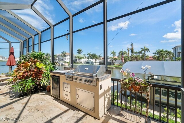 431 Palm Ct, Naples, FL 34108 - view of patio / terrace featuring area for grilling, a water view, and glass enclosure