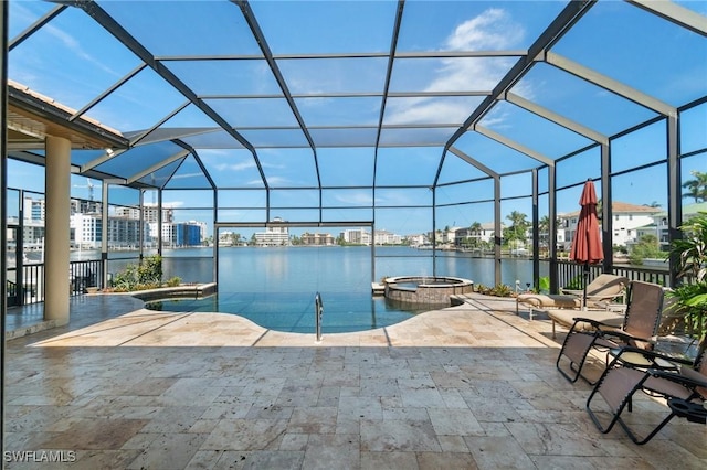 431 Palm Ct, Naples, FL 34108 - view of swimming pool featuring glass enclosure, a patio area, a water view, and a pool with connected hot tub