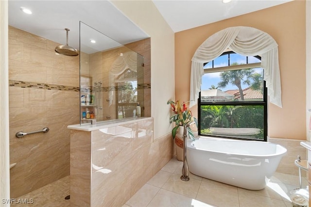 431 Palm Ct, Naples, FL 34108 - bathroom featuring walk in shower, a freestanding tub, tile patterned flooring, and recessed lighting