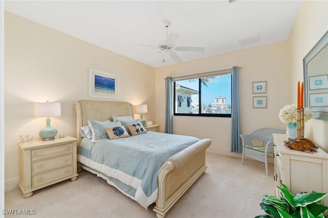431 Palm Ct, Naples, FL 34108 - bedroom with light carpet and ceiling fan