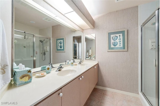 431 Palm Ct, Naples, FL 34108 - full bathroom with double vanity, a stall shower, wallpapered walls, and tile patterned floors
