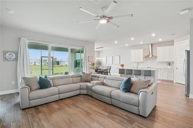 16420 Settlers Way, Punta Gorda, FL 33982 - living room with light wood finished floors, ceiling fan, and recessed lighting