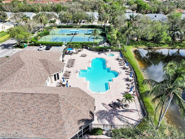 8627 Ibis Cove Cir, Naples, FL 34119 - drone / aerial view of a pool area and a large body of water
