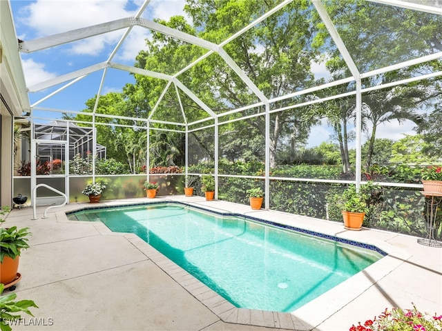8627 Ibis Cove Cir, Naples, FL 34119 - outdoor pool with a patio area and glass enclosure