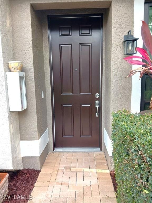 7725 Woodbrook Cir Unit 3504, Naples, FL 34104 - entrance to property featuring stucco siding