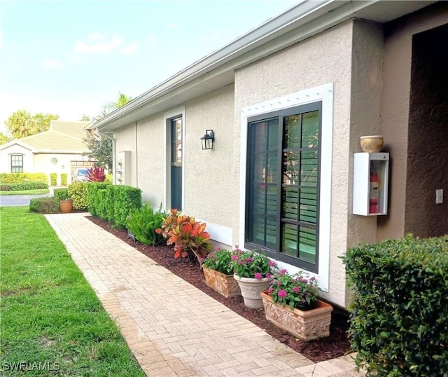 7725 Woodbrook Cir Unit 3504, Naples, FL 34104 - property entrance with stucco siding