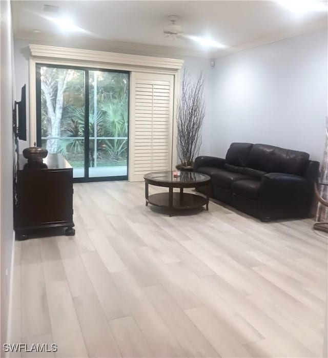 7725 Woodbrook Cir Unit 3504, Naples, FL 34104 - living room with light wood finished floors