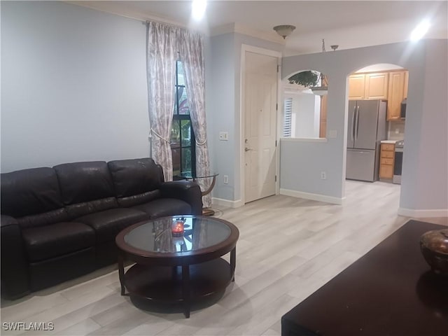7725 Woodbrook Cir Unit 3504, Naples, FL 34104 - living area with arched walkways and light wood-type flooring