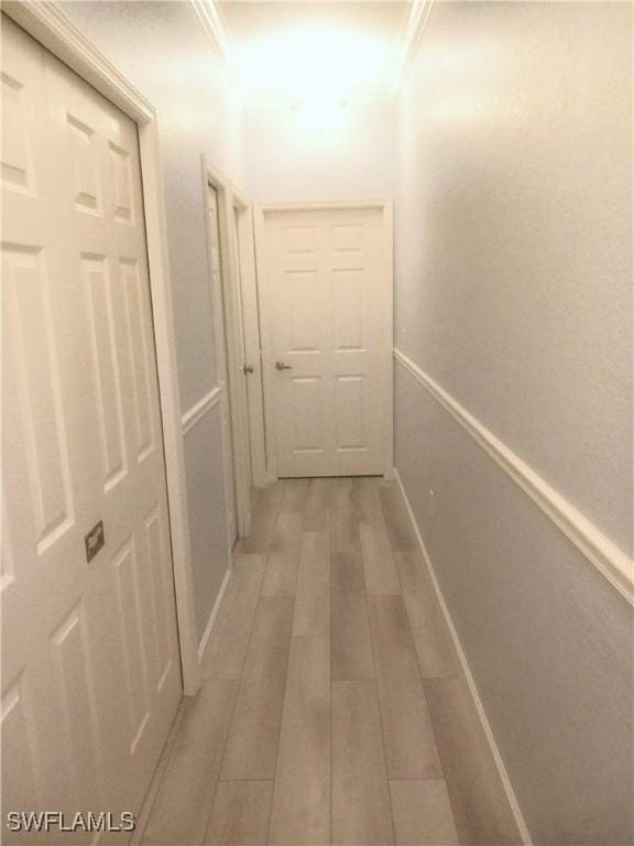 7725 Woodbrook Cir Unit 3504, Naples, FL 34104 - corridor featuring light wood-type flooring