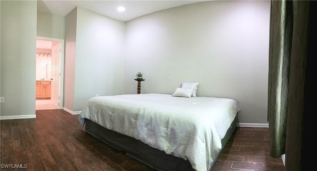 7725 Woodbrook Cir Unit 3504, Naples, FL 34104 - bedroom featuring dark wood finished floors, recessed lighting, and ensuite bathroom