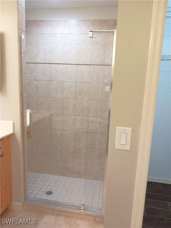 7725 Woodbrook Cir Unit 3504, Naples, FL 34104 - bathroom featuring vanity and a shower stall
