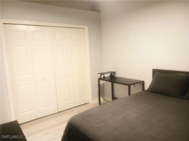 7725 Woodbrook Cir Unit 3504, Naples, FL 34104 - bedroom with wood finished floors and a closet