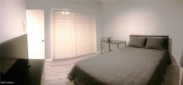 7725 Woodbrook Cir Unit 3504, Naples, FL 34104 - bedroom featuring wood finished floors and a closet