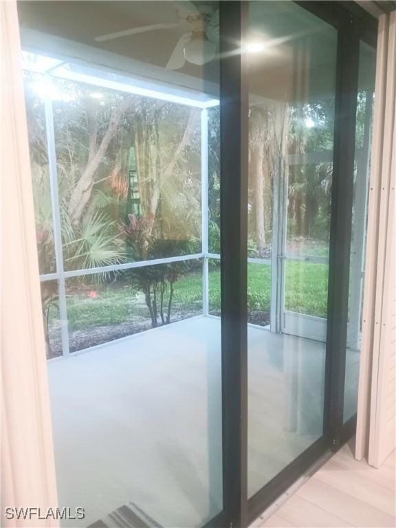 7725 Woodbrook Cir Unit 3504, Naples, FL 34104 - doorway featuring a ceiling fan