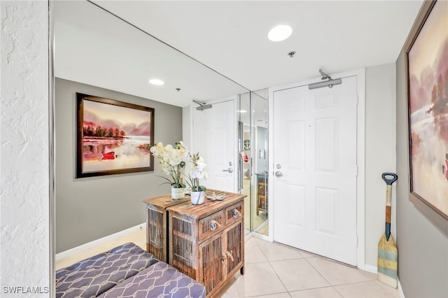 26235 Hickory Blvd Unit 9A, Bonita Springs, FL 34134 - entrance foyer with baseboards and light tile patterned floors