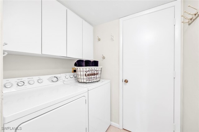 26235 Hickory Blvd Unit 9A, Bonita Springs, FL 34134 - laundry area with cabinet space and separate washer and dryer