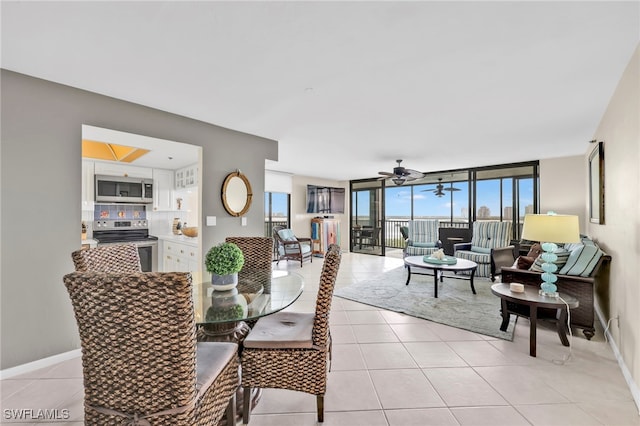 26235 Hickory Blvd Unit 9A, Bonita Springs, FL 34134 - dining area with a ceiling fan, light tile patterned floors, and expansive windows